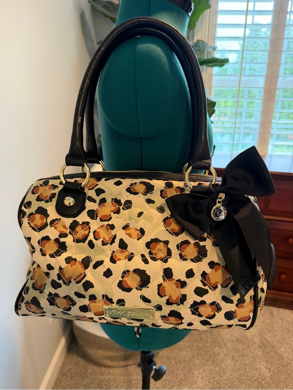 Leopard Print Handbag with Black Trim and Bow Charm